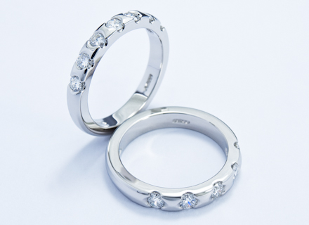 Eternity style platinum rings end set with round brilliant cut diamonds 