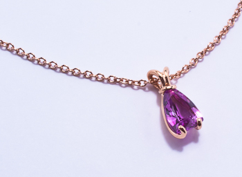 Bunny red gold pendant with sail shaped pink sapphire
