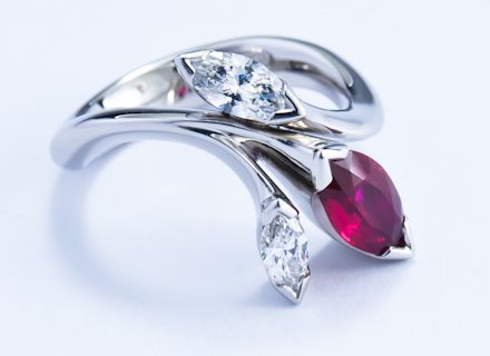Floral platinum ring with marquise cut ruby and diamonds