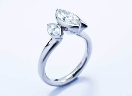 Rub over three stone platinum ring with marquise cut diamonds