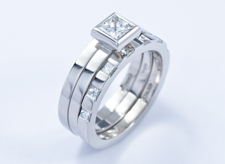 Eternity style platinum ring end set with princess cut diamonds