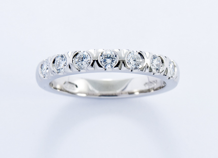 Eternity style platinum ring end set with round brilliant cut diamonds