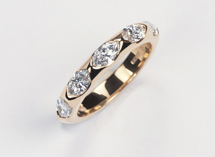 Eternity style rose gold ring end set with marquise cut diamonds